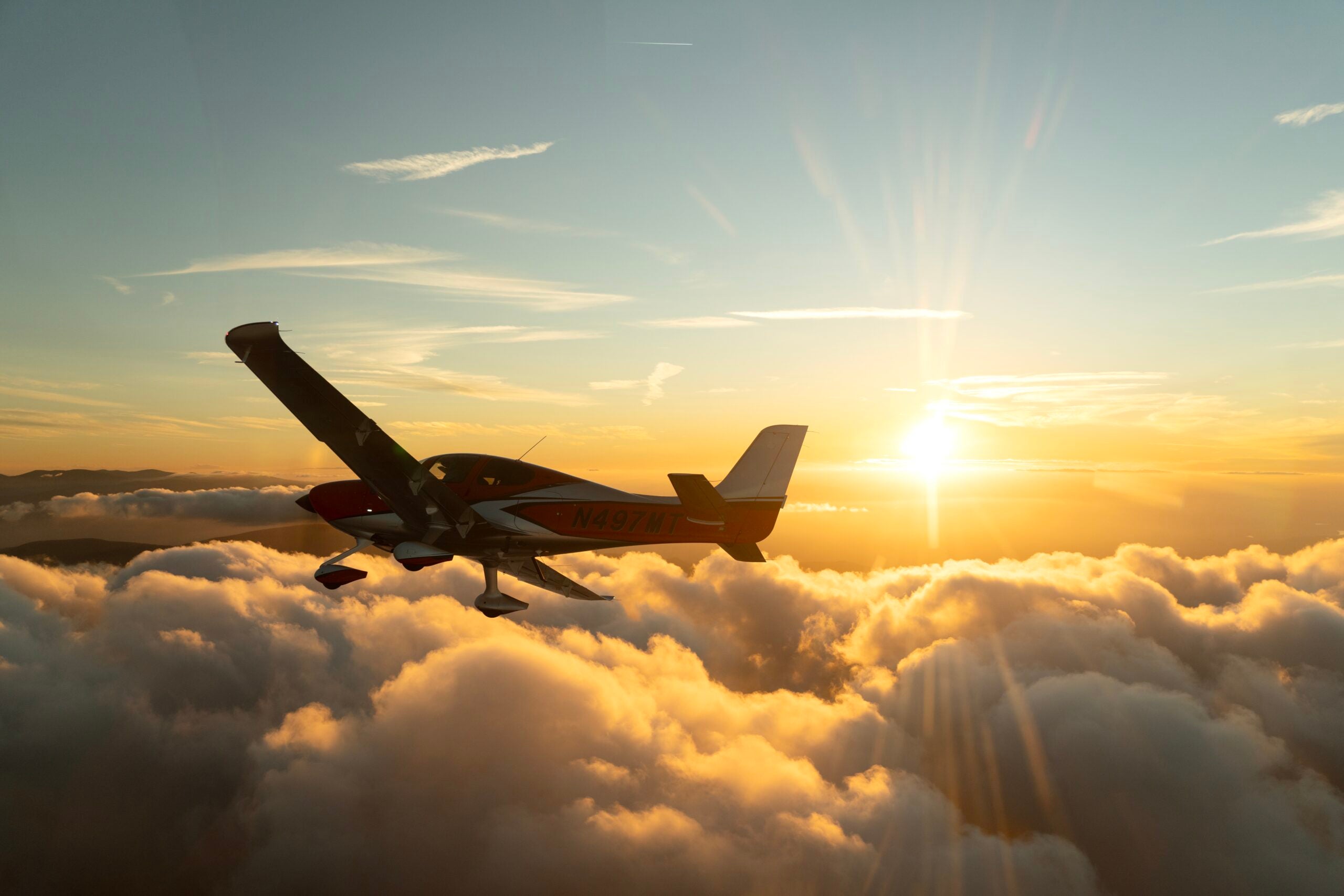 cirrus jet flying in the clouds