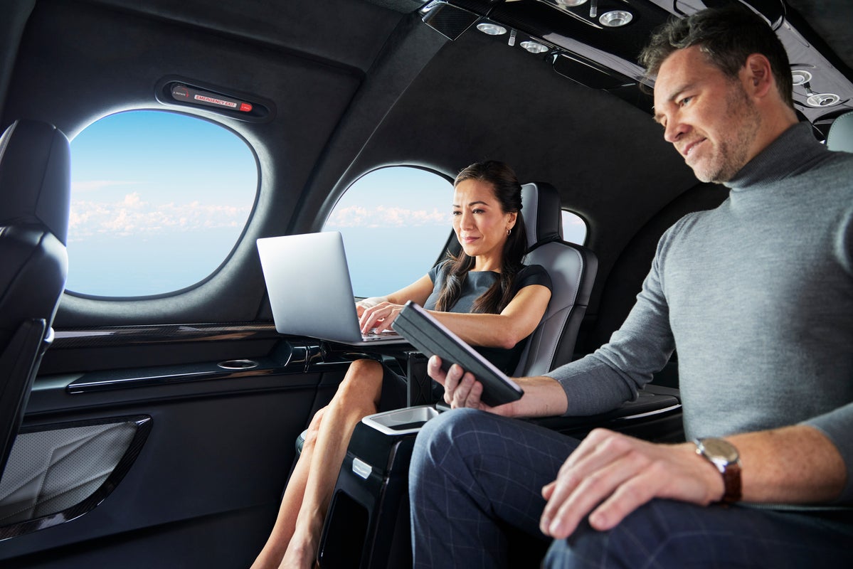 man and woman using devices