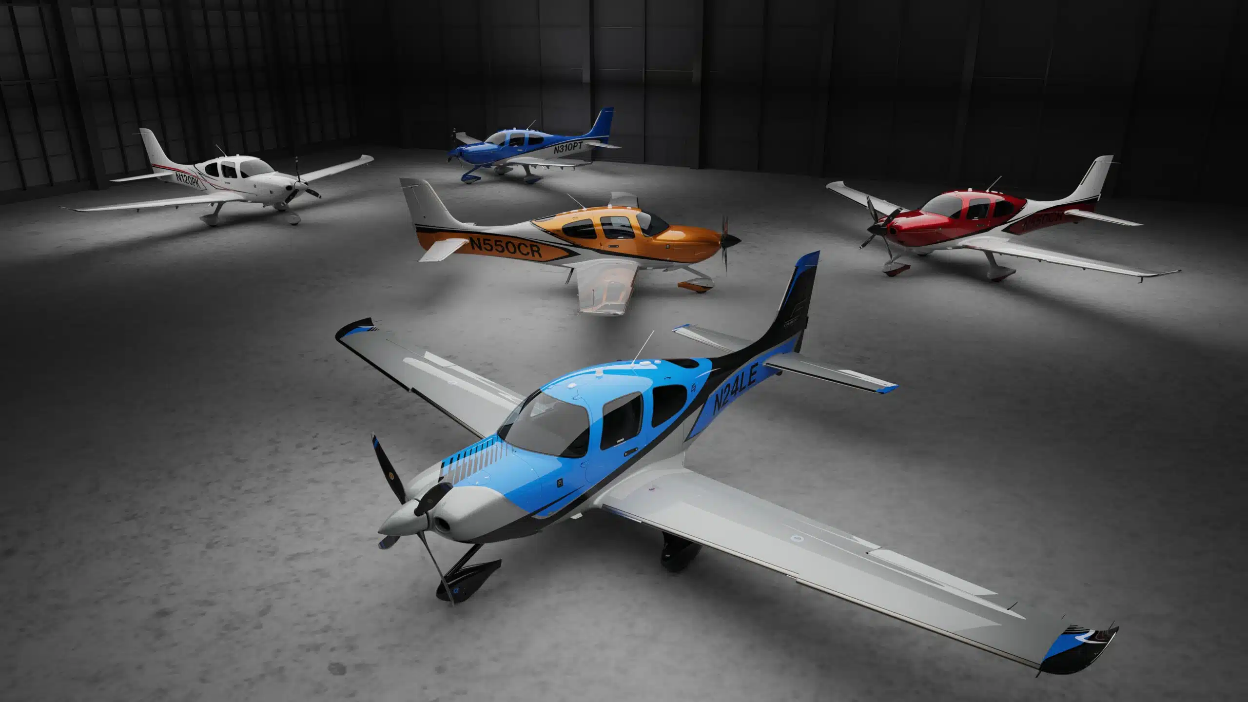 Five Cirrus planes in hangar, blue SR Series in front.