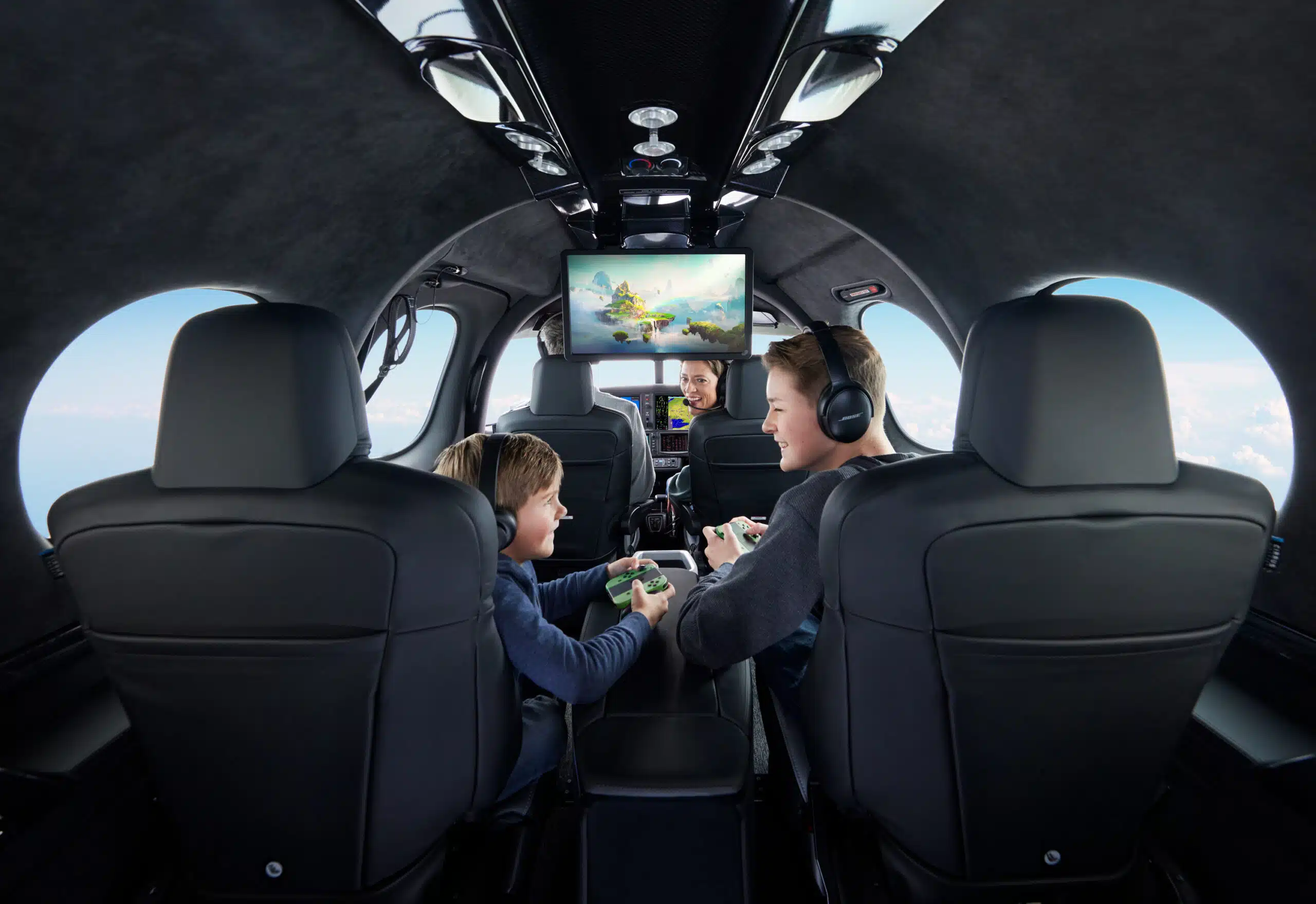 kids playing video games in plane