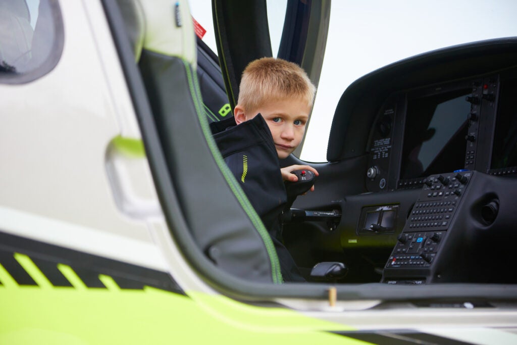 kid in a cirrus plane