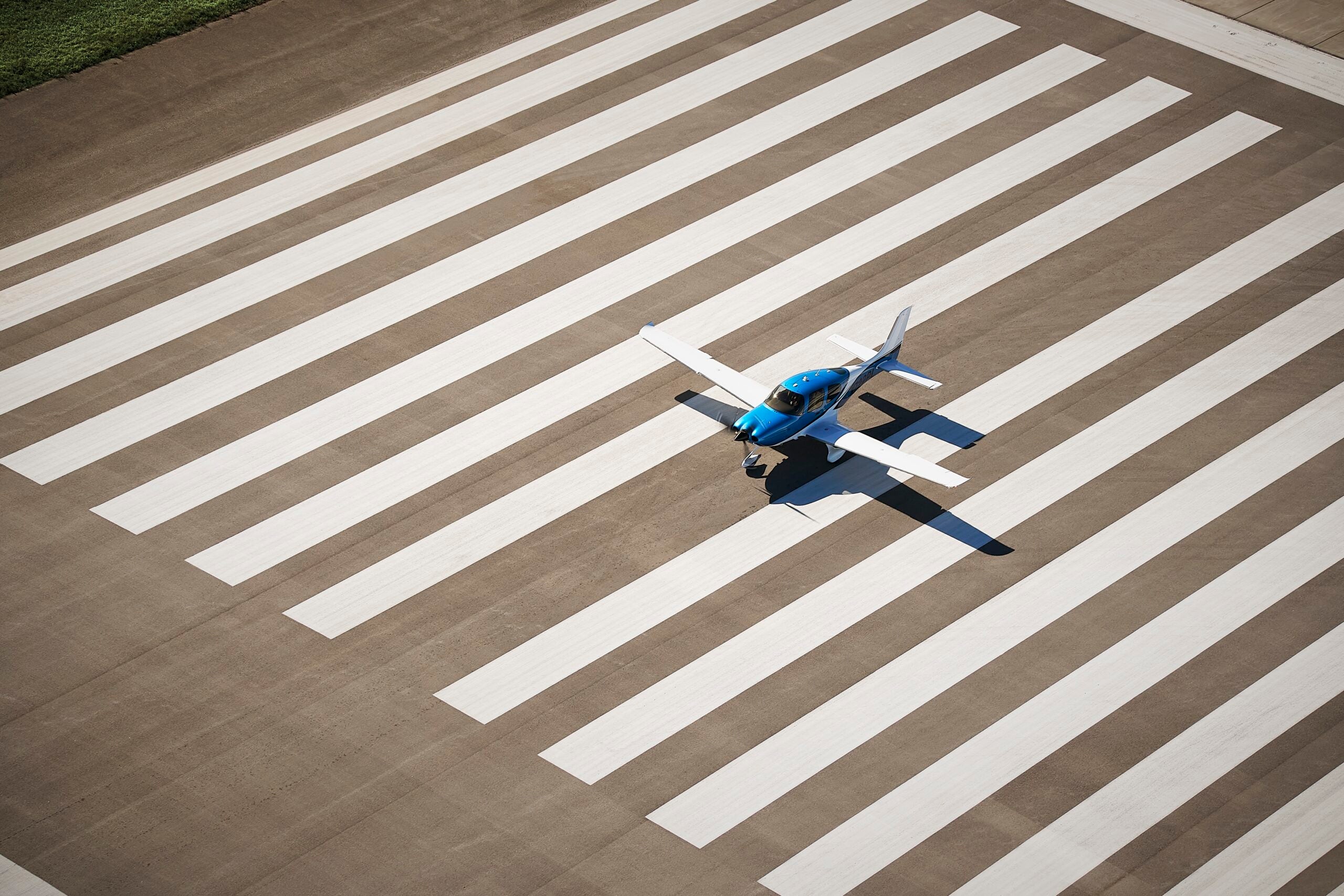 cirrus plane lined up on the runway