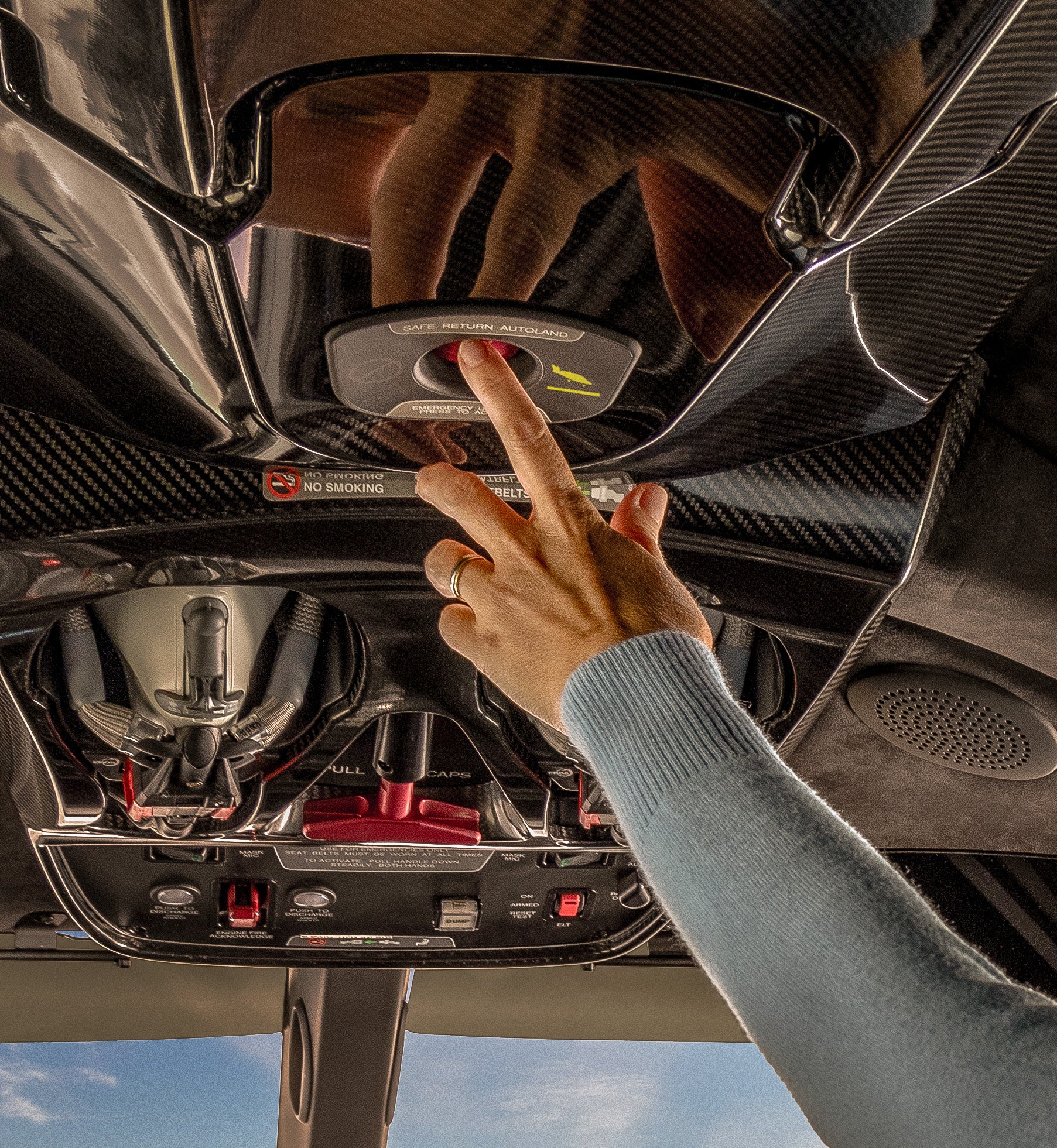 hand pushing Safe Return on Vision Jet