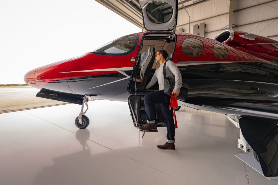 man getting in a Vision Jet