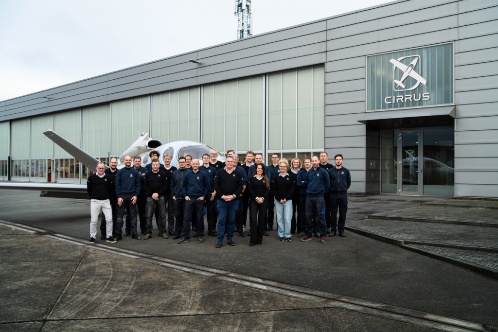Cirrus Netherlands team standing outside the Cirrus hangar at Groningen Airport Eelde